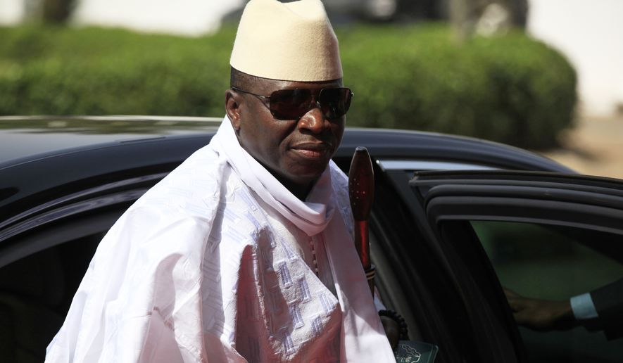 Gambia's President Yahya Jammeh arrives for a summit to address a seminar on security in Abuja, Nigeria, on Feb. 27, 2014. (AP Photo/Sunday Alamba, File)