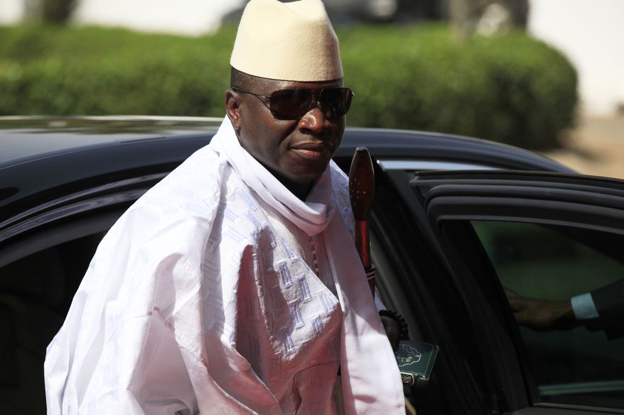 Gambia's President Yahya Jammeh arrives for a summit to address a seminar on security in Abuja, Nigeria, on Feb. 27, 2014. (AP Photo/Sunday Alamba, File)