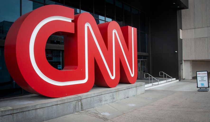 FILE - The CNN logo is displayed at the entrance to the CNN Center in Atlanta on Feb. 2, 2022. (AP Photo/Ron Harris, File)