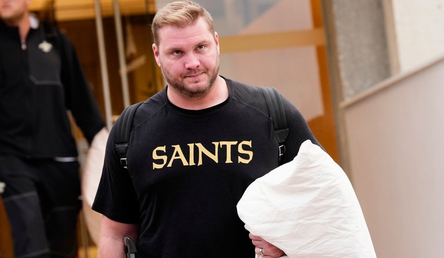 New Orleans Saints' David Edwards arrives at the reception pavilion of Charles de Gaulle airport in Roissy north of Paris, Monday, Oct. 19, 2026. (AP Photo/Teresa Suarez)