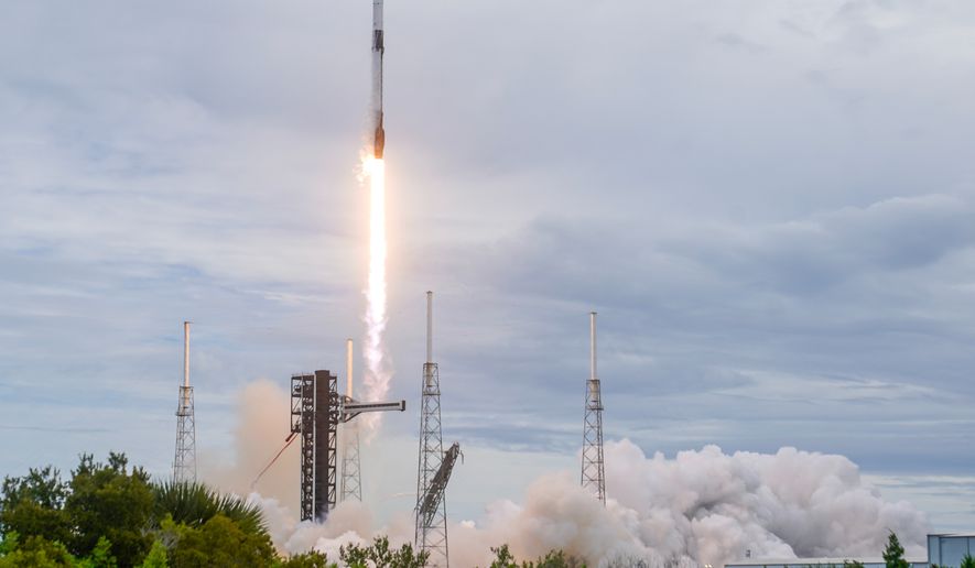 A SpaceX Falcon 9 rocket with a crew of four launches from pad 40 at the Cape Canaveral Space Force Station in Cape Canaveral, Fla., Thursday, Oct. 1, 2026. (AP Photo/John Raoux)