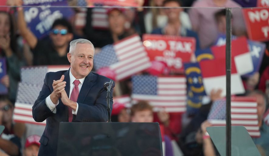 North Carolina U.S. Senate candidate Michael Whatley speaks before President Donald Trump at a campaign rally at Pitt–Greenville Airport, Tuesday, Oct. 20, 2026, in Greenville, N.C. (AP Photo/Matt Ramey)