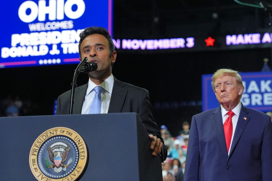 President Donald Trump listens as gubernatorial candidate Vivek Ramaswamy speaks at a campaign rally at the Covelli Centre, in Youngstown, Ohio, Monday, Oct. 12, 2026. (AP Photo/Jacquelyn Martin)