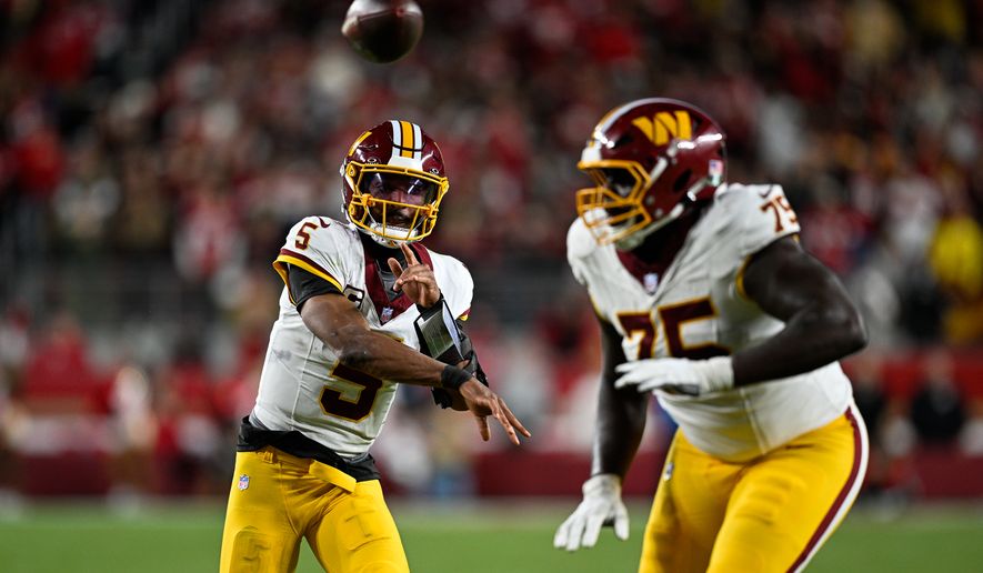 Washington Commanders quarterback Jayden Daniels (5) delivers a 9-yard touchdown pass to running back Rachaad White (1) against the San Francisco 49ers at Levi’s Stadium in Santa Clara, California, October 19, 2026. (Photo by Brian Murphy for the Washington Times)