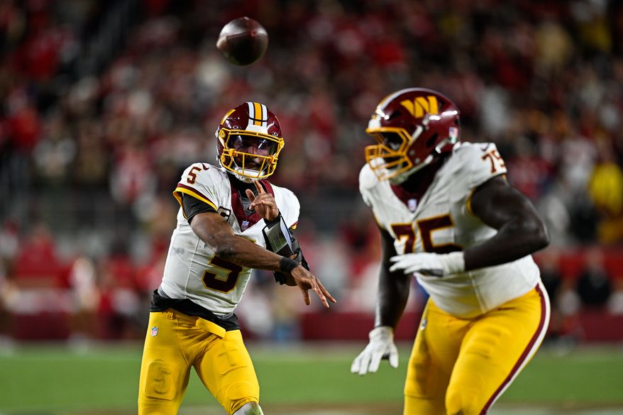 Washington Commanders quarterback Jayden Daniels (5) delivers a 9-yard touchdown pass to running back Rachaad White (1) against the San Francisco 49ers at Levi’s Stadium in Santa Clara, California, October 19, 2026. (Photo by Brian Murphy for the Washington Times)