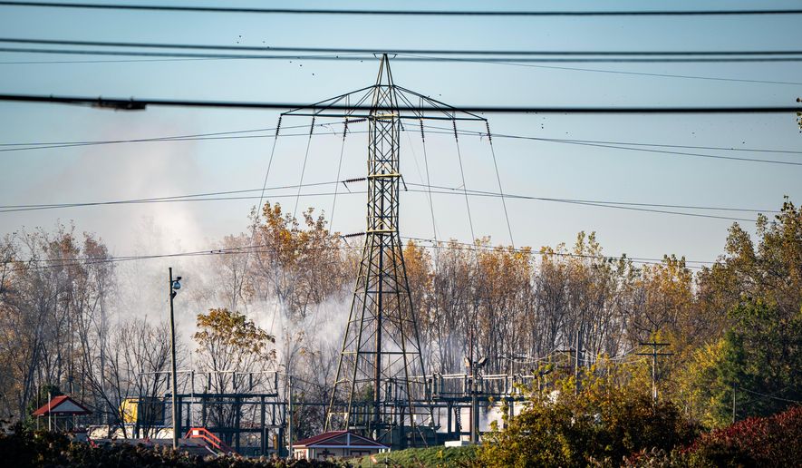 A plume of smokes rises from MC Tank Transport Inc., where a chemical tank exploded overnight, prompting hundreds of residents to evacuate or shelter in place amid concerns about a potential toxic release, Wednesday, Oct. 21, 2026, in north Toledo, Ohio. (Jeremy Wadsworth/The Blade via AP)