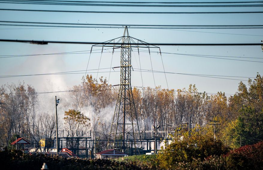 A plume of smokes rises from MC Tank Transport Inc., where a chemical tank exploded overnight, prompting hundreds of residents to evacuate or shelter in place amid concerns about a potential toxic release, Wednesday, Oct. 21, 2026, in north Toledo, Ohio. (Jeremy Wadsworth/The Blade via AP)