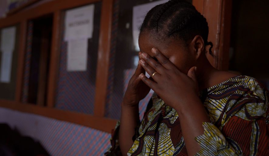 A woman reacts during an interview in Samelo psychotherapeutic health center where she receives mental health support after losing two family members and several close associates to Ebola virus, in Bunia, Congo, Oct. 15, 2026. (AP Photo/Dieudonne Dirole)