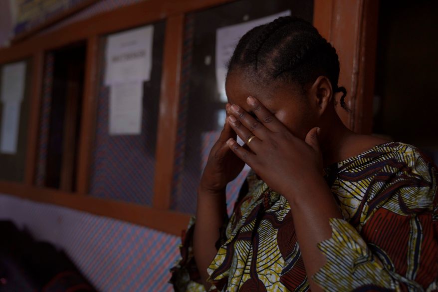 A woman reacts during an interview in Samelo psychotherapeutic health center where she receives mental health support after losing two family members and several close associates to Ebola virus, in Bunia, Congo, Oct. 15, 2026. (AP Photo/Dieudonne Dirole)