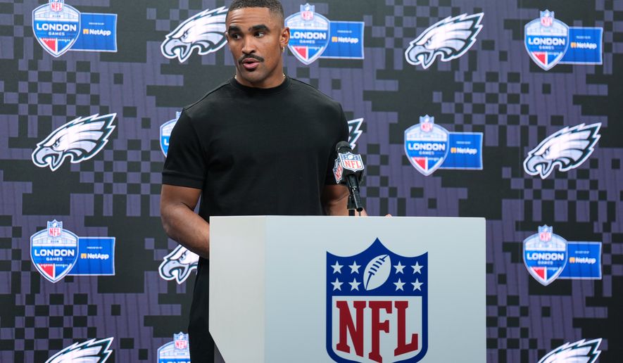 Philadelphia Eagles quarterback Jalen Hurts (1) attends a press conference after an NFL football game against Jacksonville Jaguars in London, Sunday, Oct. 11, 2026. (AP Photo/Alastair Grant)