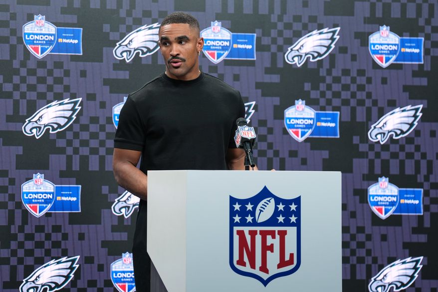 Philadelphia Eagles quarterback Jalen Hurts (1) attends a press conference after an NFL football game against Jacksonville Jaguars in London, Sunday, Oct. 11, 2026. (AP Photo/Alastair Grant)