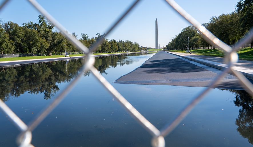 The Lincoln Memorial Reflecting Pool is blocked off to the public, Tuesday, Oct. 13, 2026, in Washington. (AP Photo/Jacquelyn Martin)
