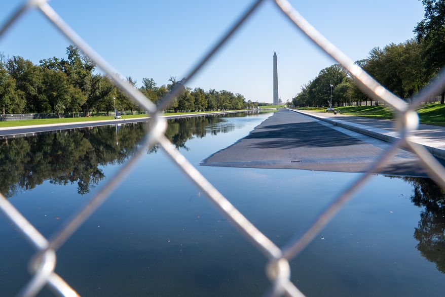 The Lincoln Memorial Reflecting Pool is blocked off to the public, Tuesday, Oct. 13, 2026, in Washington. (AP Photo/Jacquelyn Martin)