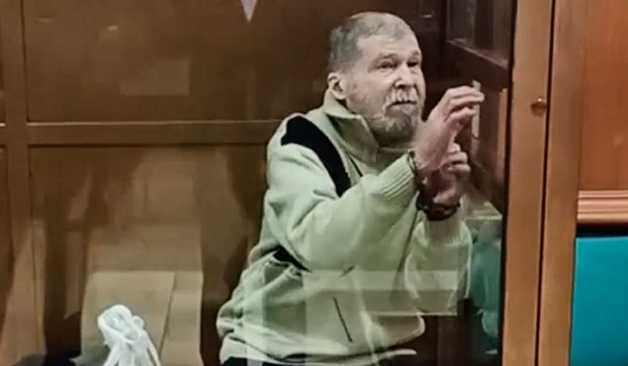 In this photo, taken from a video released by the Moscow City Court Press Service, Stephen Hubbard, a U.S. citizen accused of fighting as a mercenary in Ukraine against Russia, stands in a glass cage during a court session at the Moscow City court in Moscow, Russia, Oct. 7, 2024. (Moscow City Court Press Service via AP, File)