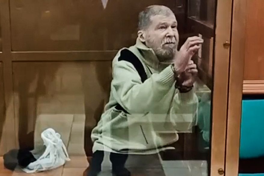 In this photo, taken from a video released by the Moscow City Court Press Service, Stephen Hubbard, a U.S. citizen accused of fighting as a mercenary in Ukraine against Russia, stands in a glass cage during a court session at the Moscow City court in Moscow, Russia, Oct. 7, 2024. (Moscow City Court Press Service via AP, File)