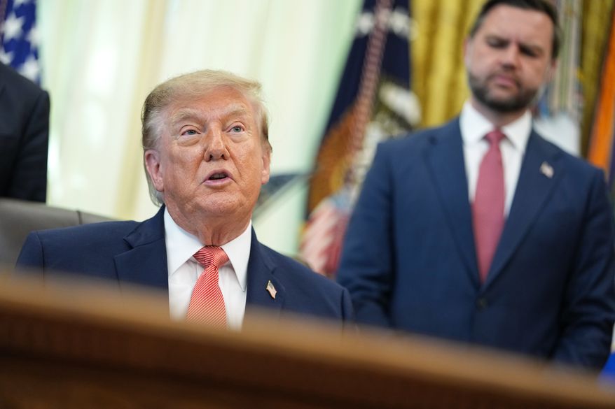 President Donald Trump speaks in the Oval Office of the White House, Tuesday, Oct. 20, 2026, in Washington, as Vice President JD Vance listens. (AP Photo/Jacquelyn Martin)