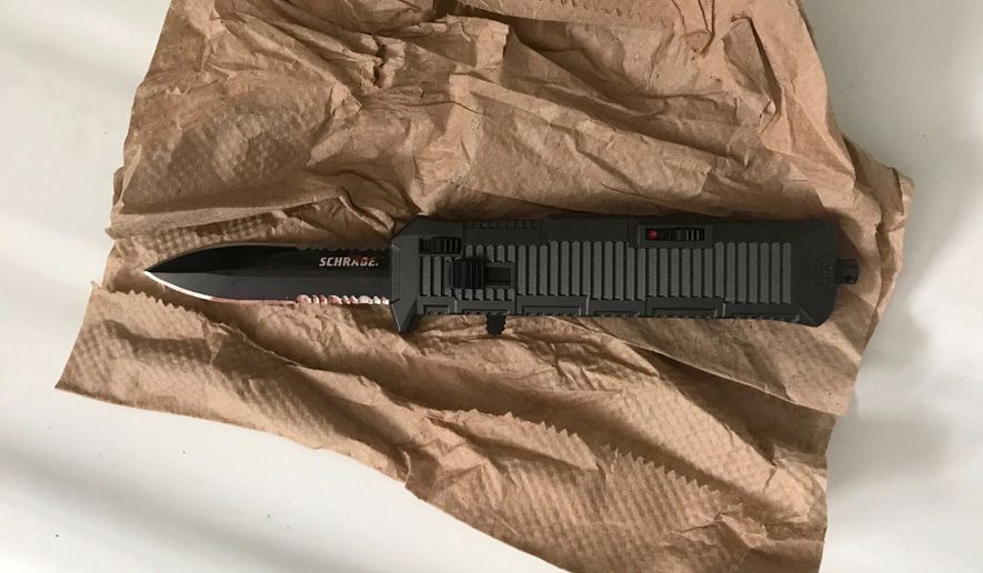 In this photo provided by the New York Police Department, a switchblade knife rests on a paper towel in New York, Wednesday, Sept. 27, 2017. Police say a high school student suddenly attacked two classmates with the knife during class at the Urban Assembly School for Wildlife Conservation on Wednesday. (New York Police via AP)