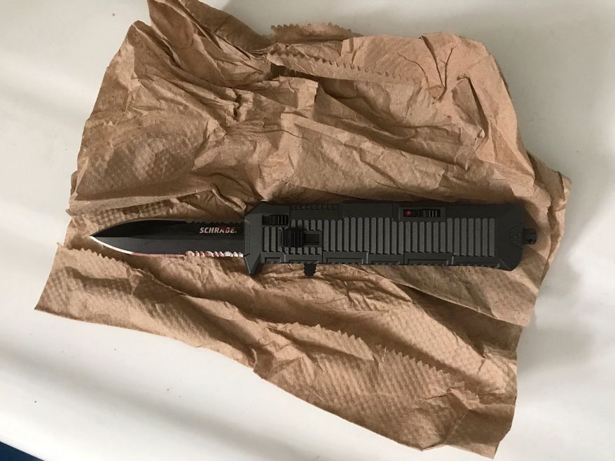 In this photo provided by the New York Police Department, a switchblade knife rests on a paper towel in New York, Wednesday, Sept. 27, 2017. Police say a high school student suddenly attacked two classmates with the knife during class at the Urban Assembly School for Wildlife Conservation on Wednesday. (New York Police via AP)