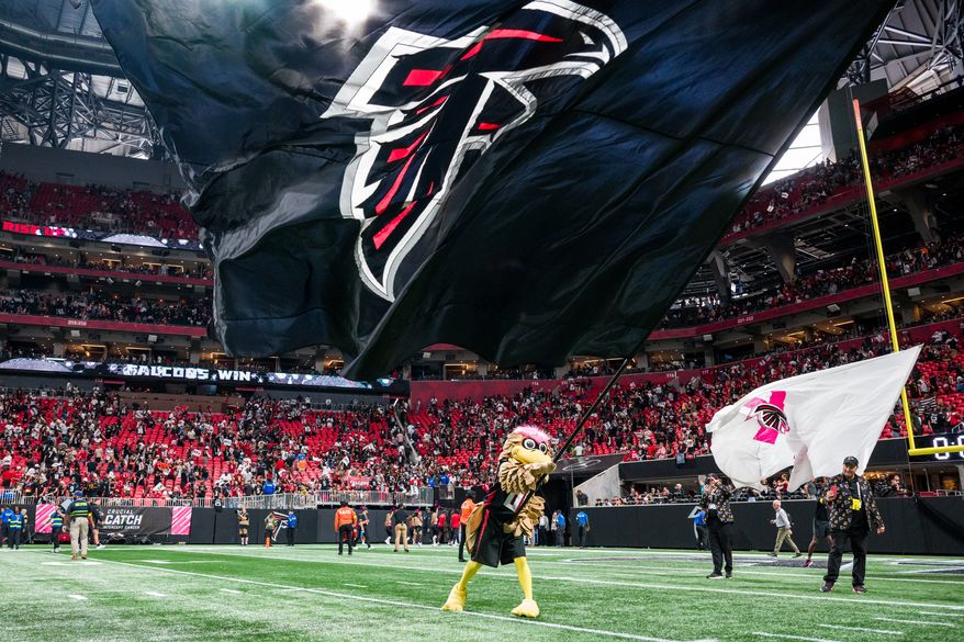 Atlanta Falcons mascot Freddie Falcon waves a flag after an NFL football game against the Washington Commanders, Sunday, Sep. 28, 2025, in Atlanta. (AP Photo/Danny Karnik) **FILE**