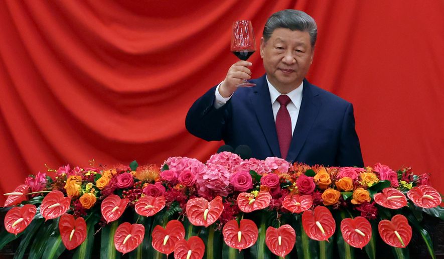 Chinese President Xi Jinping gives a toast at the National Day reception on the eve of the 77th founding anniversary of the People's Republic of China, at the Great Hall of the People in Beijing, China, Wednesday, Sept. 30, 2026. (Florence Lo/Pool Photo via AP)