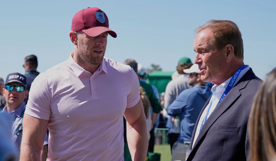 Former NFL player J.J. Watt, left, talks with sportscaster Jim Nantz during the final round at the Masters golf tournament, April 13, 2025, in Augusta, Ga. (AP Photo/Ashley Landis, File)
