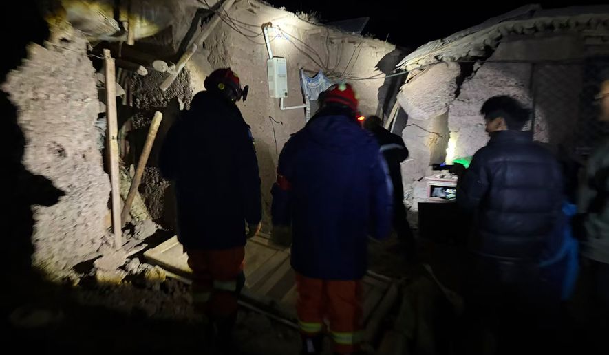 In this photo released by Xinhua News Agency, firefighters inspect an earthquake-hit village houses in Baqen County of Nagqu City in China's Tibet autonomous region, on Friday, Oct. 23, 2026. (Xinhua via AP)