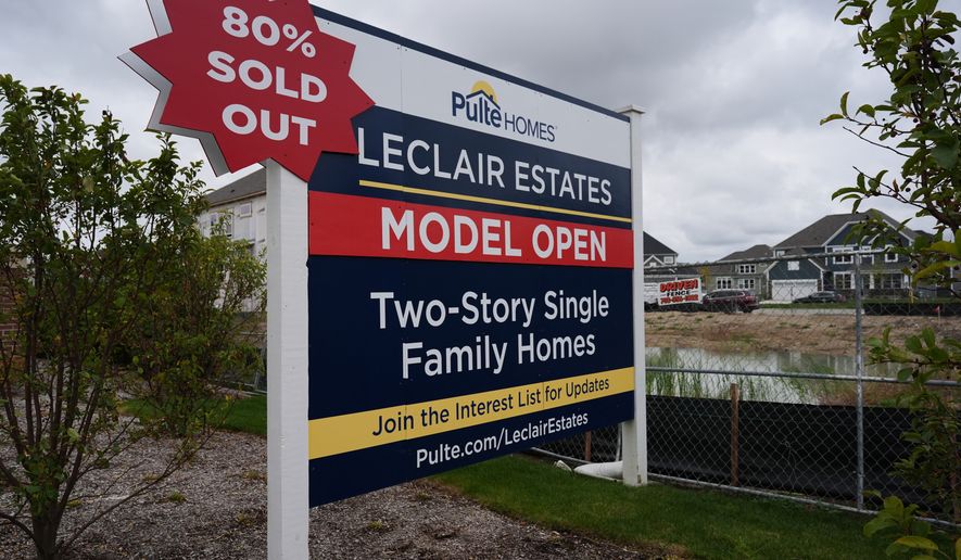 A sign stands in front of a new home construction site in Deerfield, Ill., Wednesday, Oct. 14, 2026. (AP Photo/Nam Y. Huh)