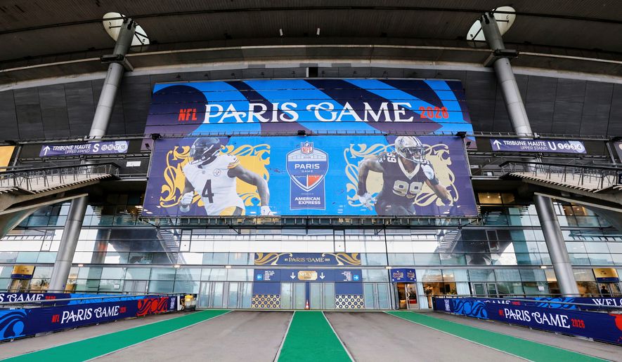 An exterior view of the Stade de France with NFL branding on Thursday, Oct. 22, 2026, in Saint-Denis, north of Paris, ahead of Sunday's game between the Pittsburgh Steelers and the New Orleans Saints. (AP Photo/Greg Payan)