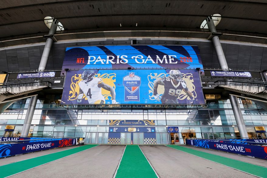 An exterior view of the Stade de France with NFL branding on Thursday, Oct. 22, 2026, in Saint-Denis, north of Paris, ahead of Sunday's game between the Pittsburgh Steelers and the New Orleans Saints. (AP Photo/Greg Payan)