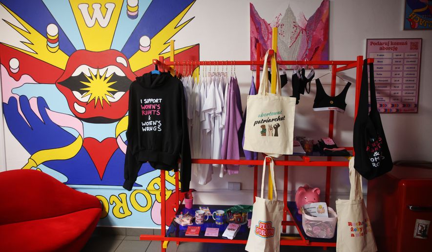 Some merchandise is displayed at an information center about abortion options run by the women's organizations Abortion Dream Team and Women Help Women, in Warsaw, Poland, Thursday, Oct. 22, 2026. (AP Photo/Beata Zawrzel)
