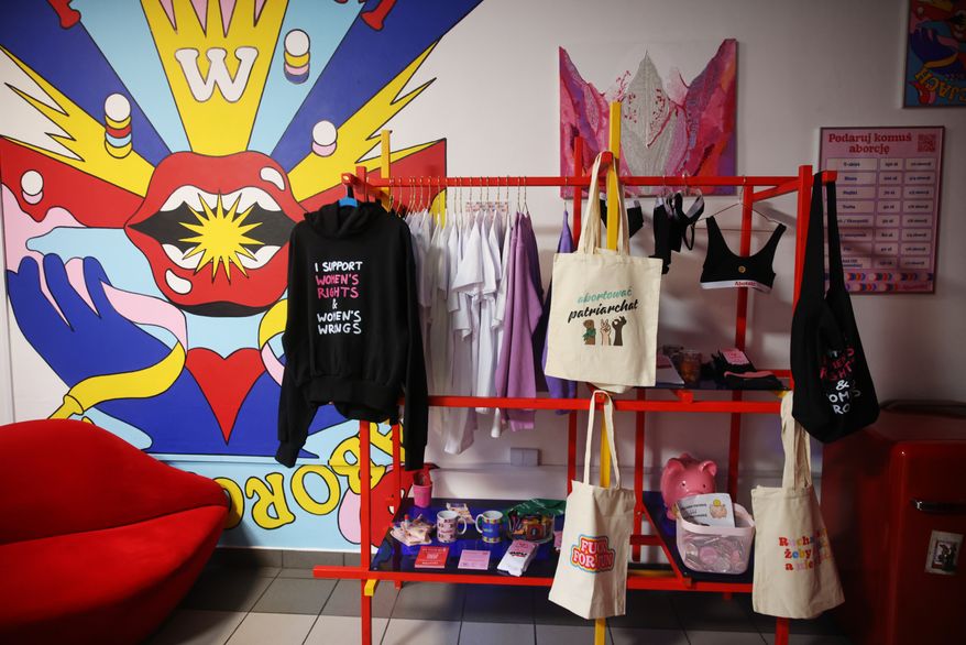 Some merchandise is displayed at an information center about abortion options run by the women's organizations Abortion Dream Team and Women Help Women, in Warsaw, Poland, Thursday, Oct. 22, 2026. (AP Photo/Beata Zawrzel)