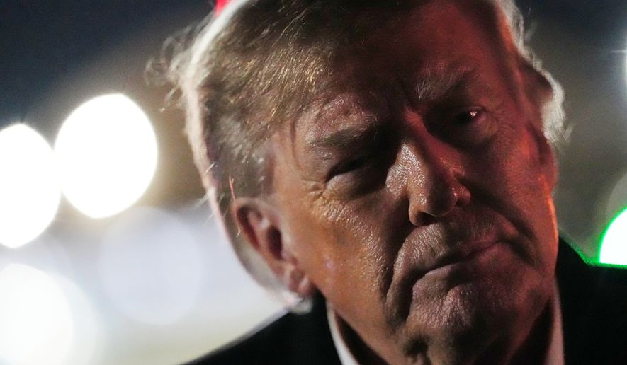 President Donald Trump speaks to reporters after arriving on Air Force One, Wednesday, Oct. 21, 2026, at Joint Base Andrews, Md. (AP Photo/Julia Demaree Nikhinson)
