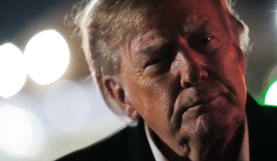 President Donald Trump speaks to reporters after arriving on Air Force One, Wednesday, Oct. 21, 2026, at Joint Base Andrews, Md. (AP Photo/Julia Demaree Nikhinson)