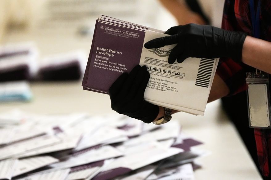 Department of Elections workers sort mail-in ballots for the California primary election at City Hall in San Francisco on Tuesday, June 2, 2026. (AP Photo/Jeff Chiu, File)