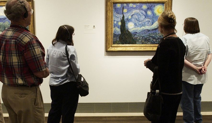 FILE - Visitors to the Museum of Fine Arts, Houston view Vincent van Gogh's painting, "The Starry Night," on Oct. 17, 2003, in Houston. (AP Photo/David J. Phillip, File)