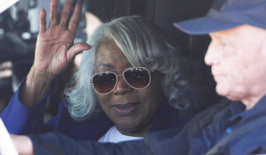 Virginia State Sen. Louise Lucas, D-Portsmouth, waves as she leaves federal court, Thursday Oct. 22, 2026, in Norfolk, Va. (AP Photo/Steve Helber)