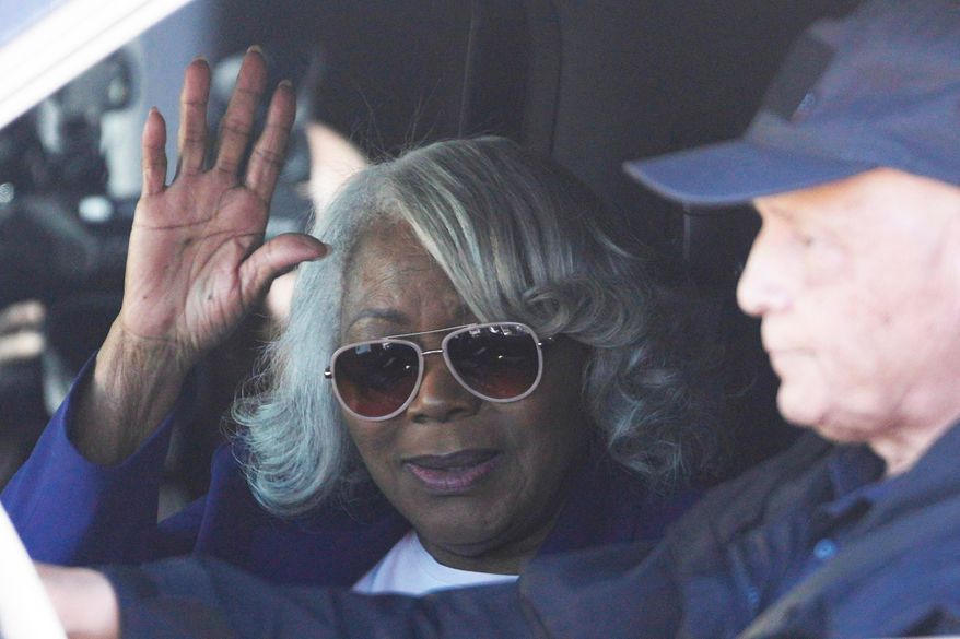 Virginia State Sen. Louise Lucas, D-Portsmouth, waves as she leaves federal court, Thursday Oct. 22, 2026, in Norfolk, Va. (AP Photo/Steve Helber)