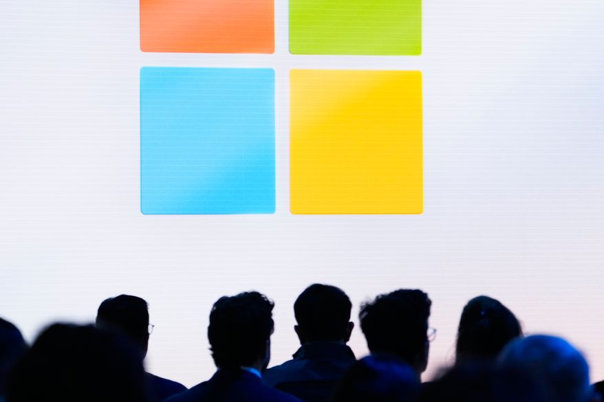 People attend a showcase event of the company's AI assistant, Copilot, ahead of the annual Build developer conference at Microsoft headquarters, Monday, May 20, 2024, in Redmond, Wash. (AP Photo/Lindsey Wasson, File)