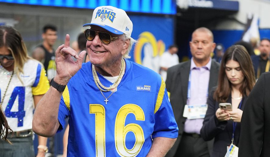 Professional wrestler Ric Flair walks on the field before an NFL football game between the Los Angeles Rams and the San Francisco 49ers, Thursday, Oct. 2, 2025, in Inglewood, Calif. (AP Photo/Marcio Jose Sanchez)