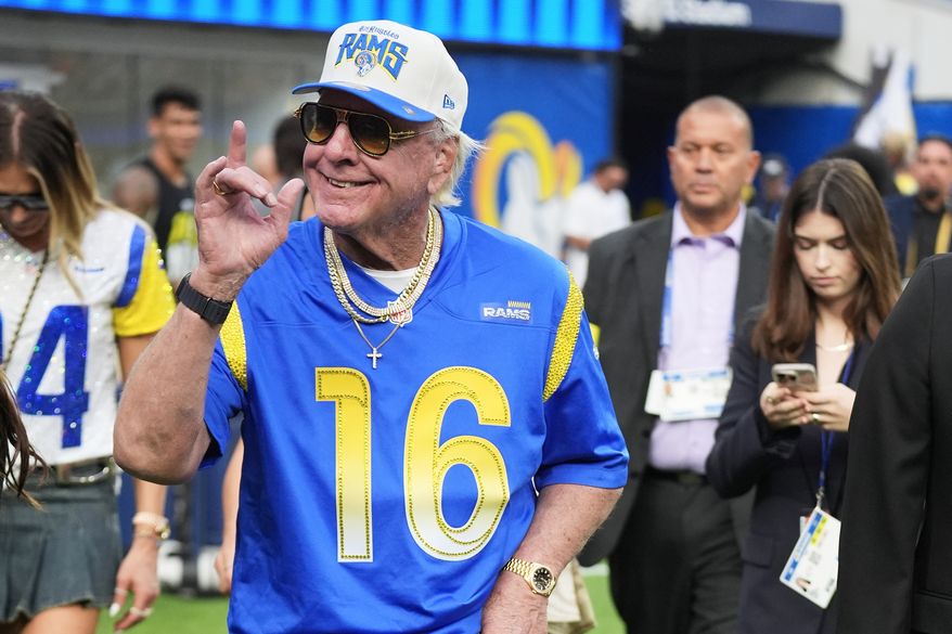 Professional wrestler Ric Flair walks on the field before an NFL football game between the Los Angeles Rams and the San Francisco 49ers, Thursday, Oct. 2, 2025, in Inglewood, Calif. (AP Photo/Marcio Jose Sanchez)