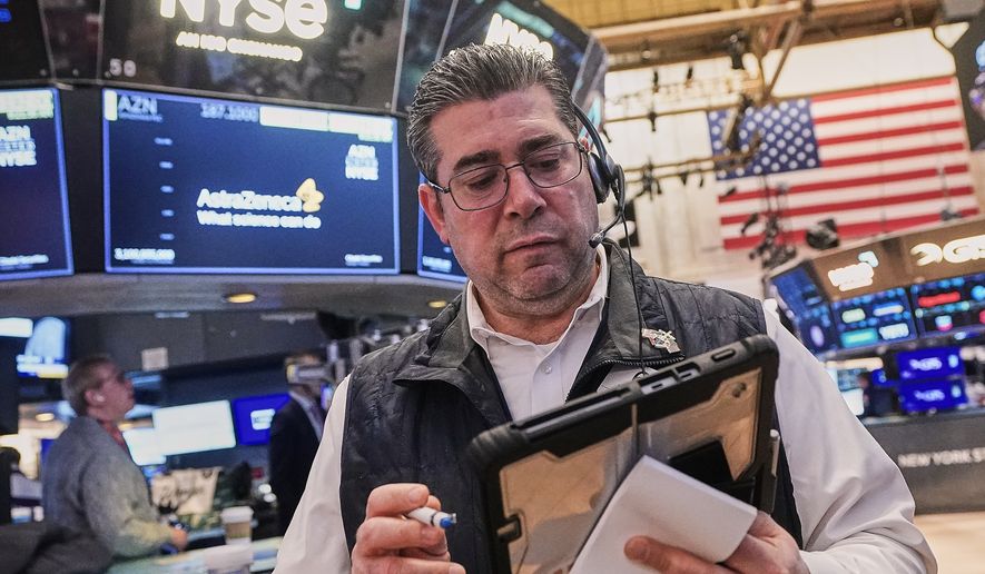 FILE - Trader Michael Capolino works on the floor of the New York Stock Exchange, Monday, Feb. 2, 2026. (AP Photo/Richard Drew, File)