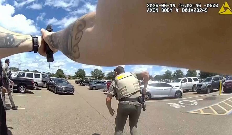 This image provided by the Mississippi Department of Public Safety shows body-camera footage of officers responding to a scene where a 1-year-old boy was shot by law enforcement in Senatobia, Miss., on June 14, 2026. (Mississippi Department Of Public Safety via AP)