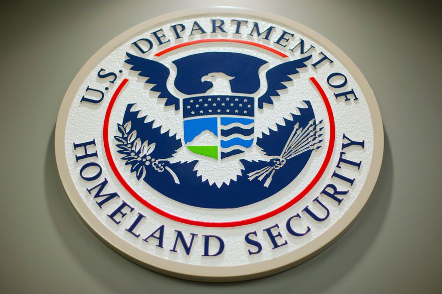 FILE - The Department of Homeland Security logo is displayed during a news conference in Washington, Feb. 25, 2015. (AP Photo/Pablo Martinez Monsivais, File)