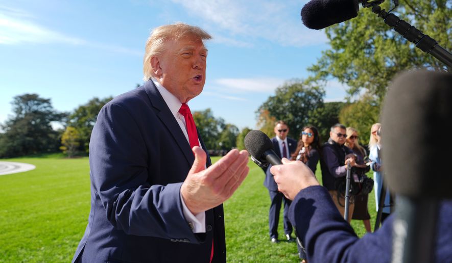President Donald Trump speaks with reporters before boarding Marine One on the South Lawn of the White House, Friday, Oct. 23, 2026, in Washington. (AP Photo/Julia Demaree Nikhinson)