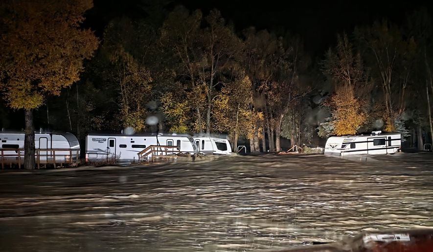 Floodwaters surround trailers at the Fun Valley Family Resort campground and RV part in South Fork, Colo., early Friday, Oct. 23, 2026. (South Fork Fire Rescue via AP)