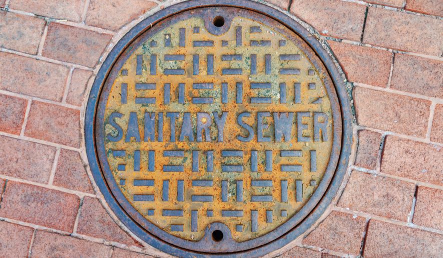 A manhole cover of a sewer in Baltimore. File photo credit: SUNGMOON HAN via Shutterstock.