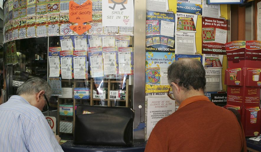 People queue to play Superenalotto in Milan, Italy, Tuesday, Aug. 18, 2009. (AP Photo/Alberto Pellaschiar)