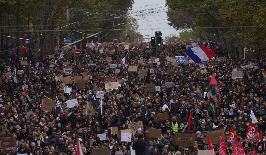 Protesters march during a demonstration against rising living costs in Paris, Saturday, Oct. 24, 2026. (AP Photo/Thibault Camus)