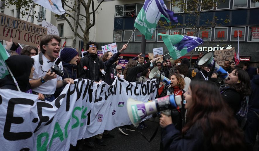 Students chant slogans during a demonstration against rising living costs in Paris, Saturday, Oct. 24, 2026. (AP Photo/Thibault Camus)