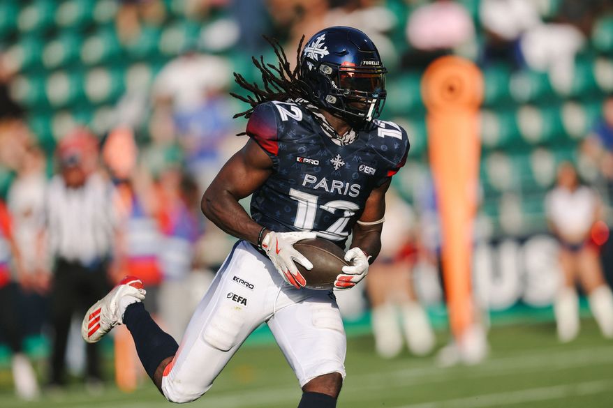 This photo provided by Maxime Le Pihif shows Paris Musketeers wide receiver Hugo Tekedam catching a pass during a game against the Prague Lions on May 24, 2026, in Saint-Ouen-sur-Seine, France. (Maxime Le Pihif via AP)